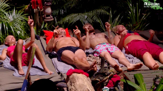 Danielle Harold, Nick Pickard, Sam Thompson and Josie Gibson lie in the sun singing together