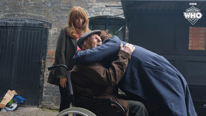 The Doctor hugs Wilf as Donna looks on happily in 'Wild Blue Yonder'.