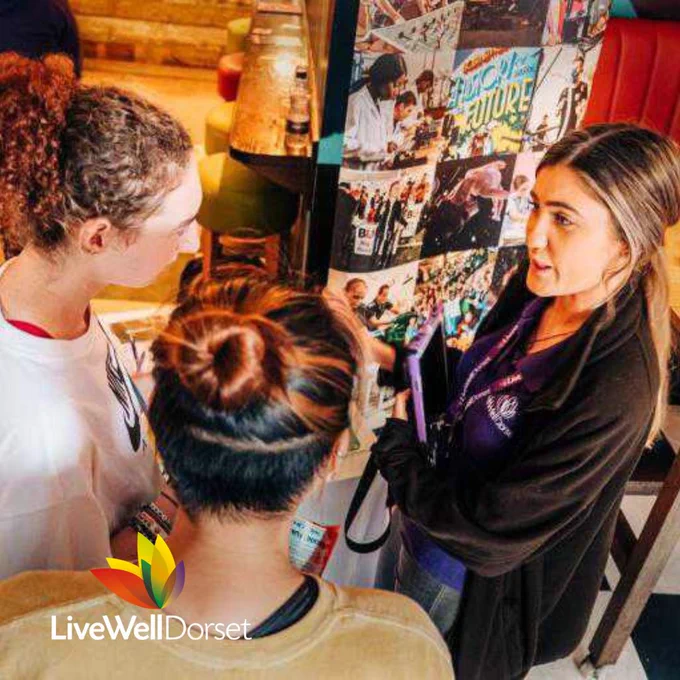 A member of LiveWell Dorset talking to the public at a promotional event