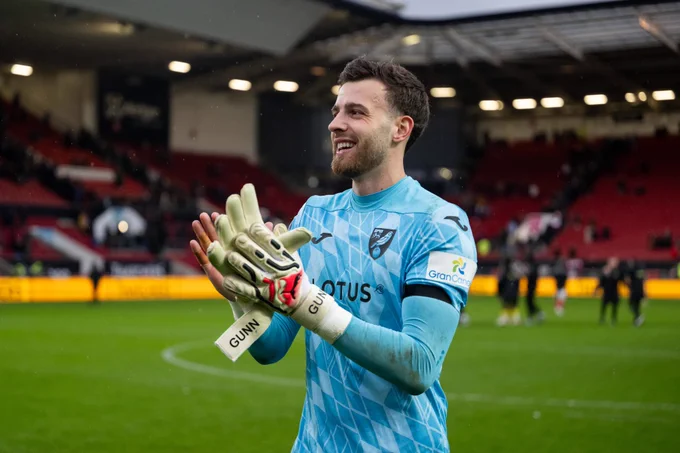 Angus Gunn applauds the travelling Norwich City fans at Ashton Gate Stadium