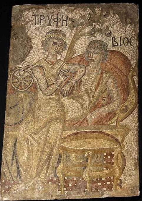 In the mosaic, a wealthy couple is shown engaged in relaxed conversation on an elegant sofa. The allegorical meaning is described through the Greek inscription tryphe - bios which identifies the female figure as Tryphe, meaning sweet and pleasant living. The male figure is Bios, which means Life. Existence should be accompanied by a pleasant life. The man is shown holding a wheel in his right hand, a means used to keep lovers together. His presence underlines the idea that Life and Easy Living should be inseparable.