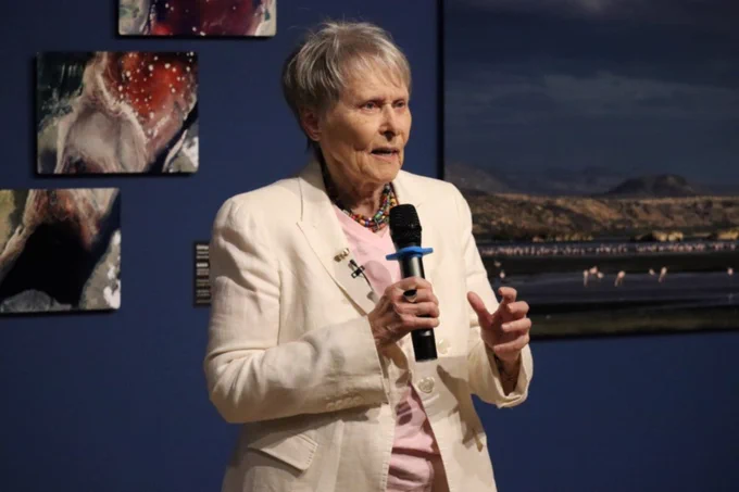 Dr. Roberta Bondar holding a microphone.