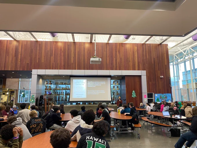Librarian Di Zhang talks about Shoshana Zuboff's book "The Age of Surveillance capitalism in front of 10th grade students at Lake Washington High School.