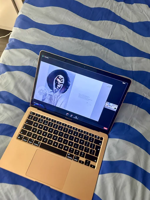 Picture of a laptop. Black futuristic image on screen