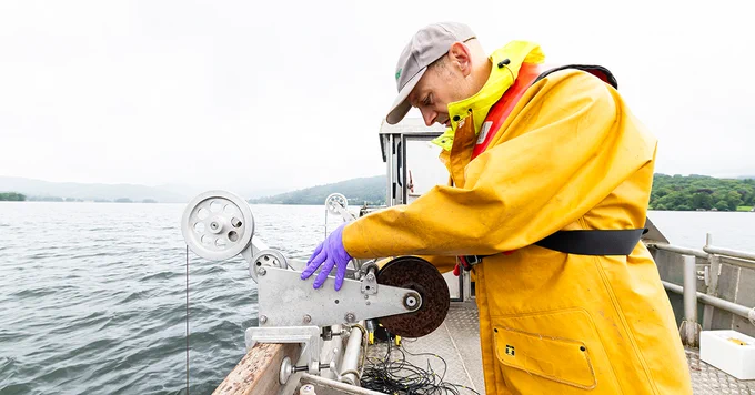 UKCEH scientist Glenn Rhodes using a winch on the John Lund vessel on Windermere