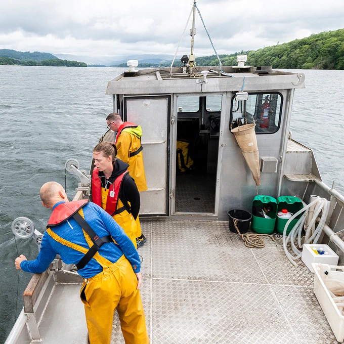 Three UKCEH scientists on the John Lund vessel on Windermere