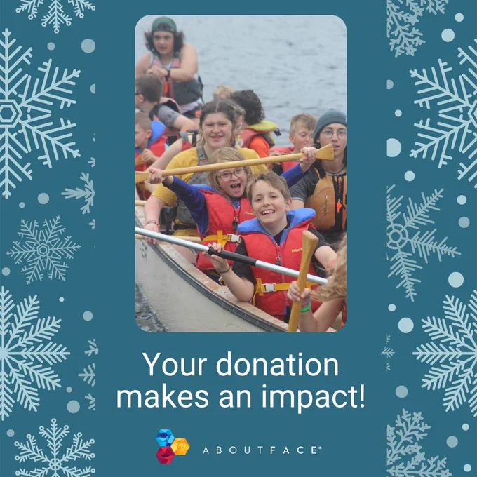 blue background with white snowflakes. There is a photo of kids in a canoe in the middle with white text below that reads "your donation makes an impact" with the AboutFace logo below. 