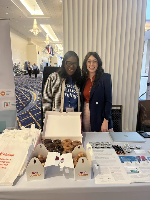 KickUp booth with swag and donuts