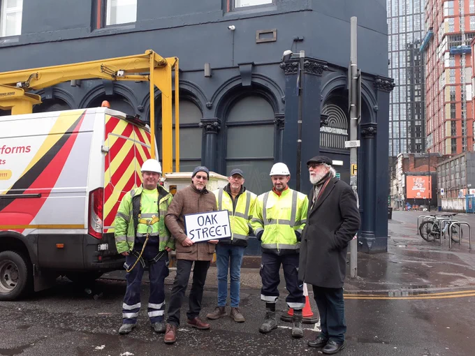 Tim and Liam with Highway Operatives with the new design street name sign