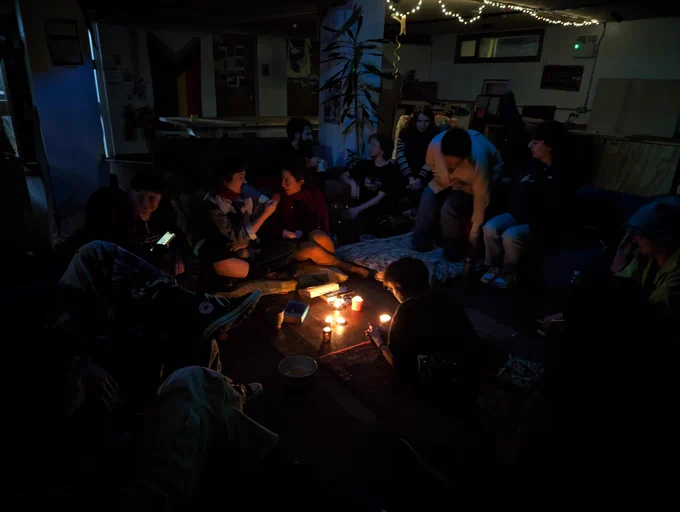 Co-op members gathered around for Candlelight Ceilidh. 