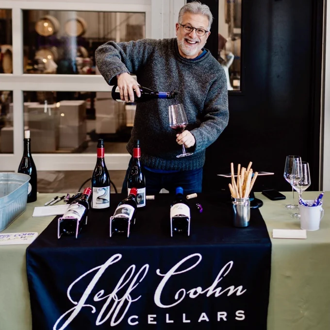 Jeff Cohn pours a glass of Zinfandel at Grand Cru Custom Crush's Holiday Open House