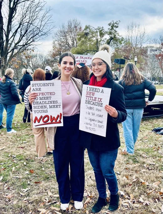 Leadership Conference staff members hold up signs outside the White House urging the administration to release its final Title IX rule immediately.