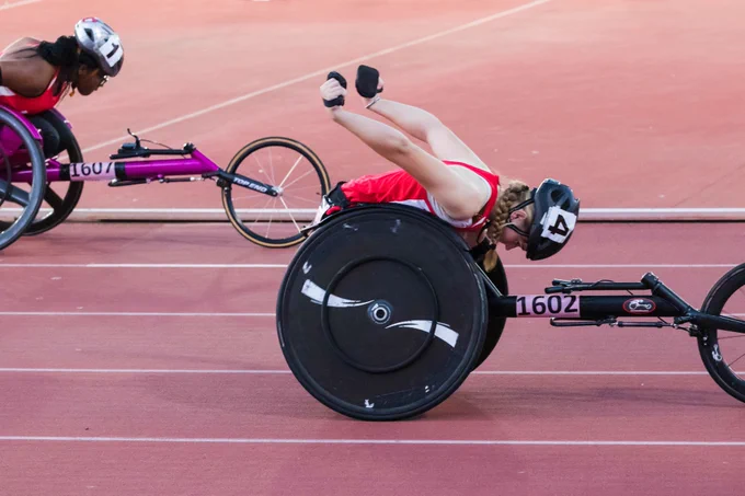 two athletes wheelchair racing in a competition