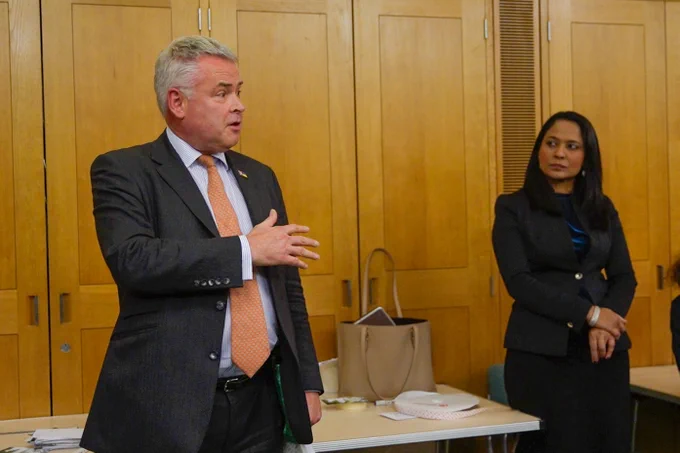 Tim Loughton MP and Rushanara Ali MP speaking to the young people at the #GetCreative4ClimateJustice exhibition. 