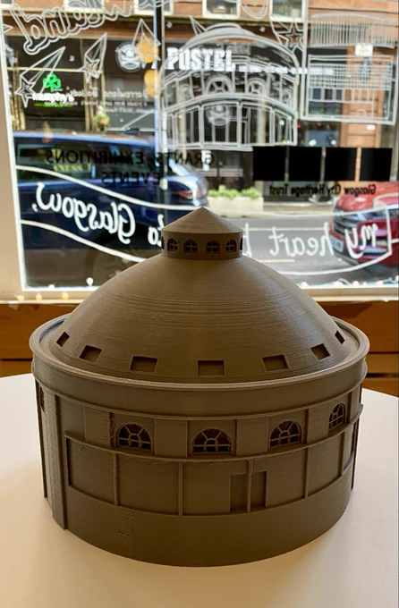 This a a 3D print resin model of the South Rotunda that Glasgow City Heritage Trust have in our 54 Bell Street office. In the background is a section of the mural recently painted on our shopfront window. The mural includes a white line drawing of the South Rotunda.