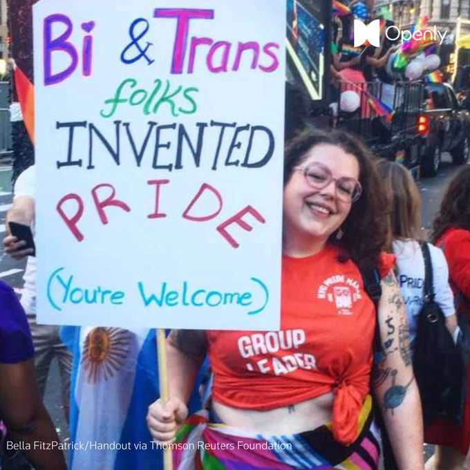 Bella FitzPatrick poses with a sign during a LGBTQ  Pride march in New York