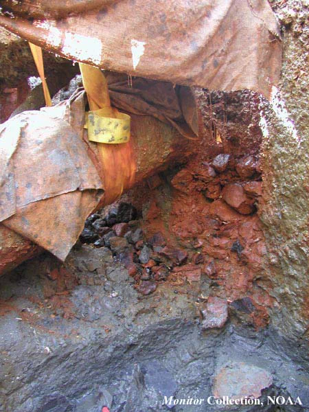 Close-up of some loose and some concreted coal lying on the roof rails under the starboard gun carriage. Click image for larger view and detailed explanation.

