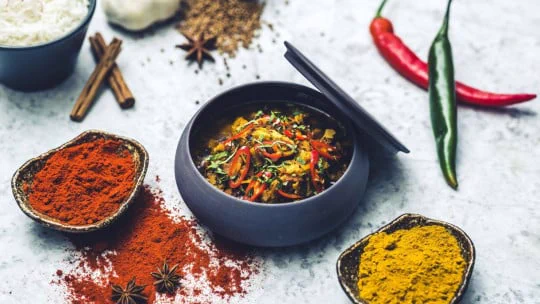 Spices and ingredients on a table.