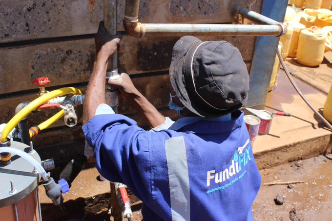 An engineer working on an external pipe