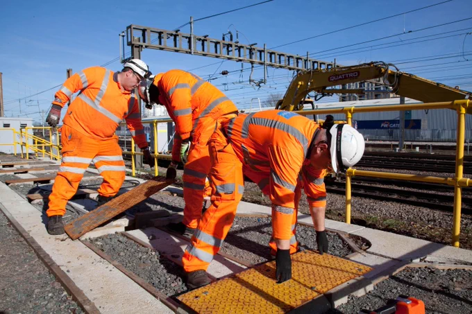 Engineers fitting new cables as part of the East Coast Digital Programme.