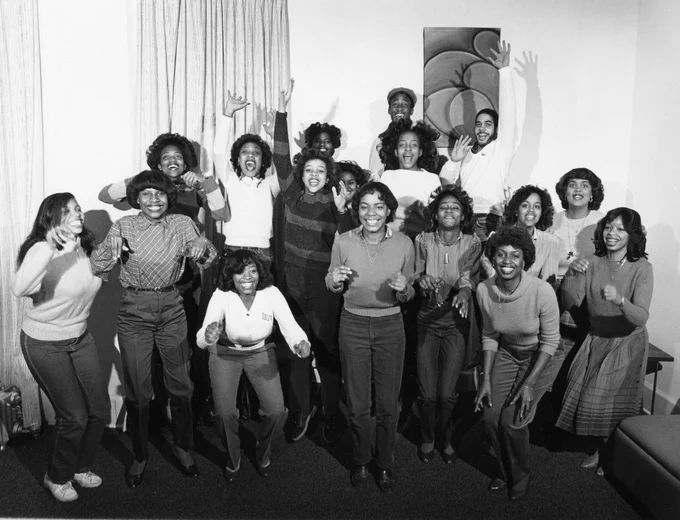 Group portrait of the Black Student Alliance. Members in different stages of jumping. Black and White photograph