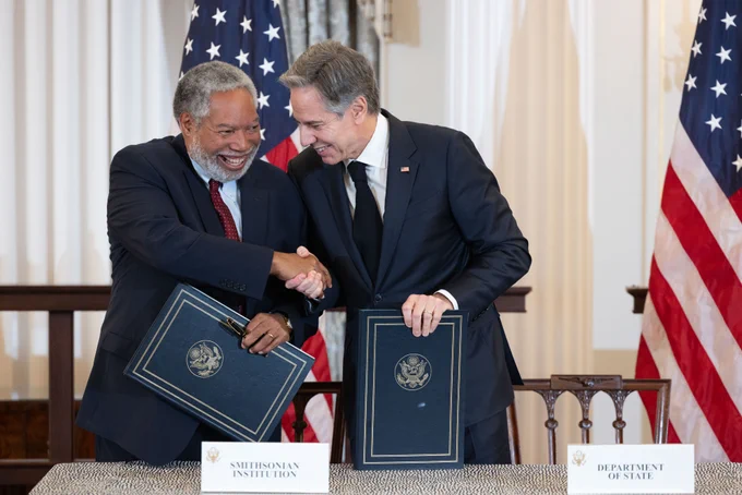 Secretaries Blinken and Bunch smile and shake hands after the signing.

Photo courtesy Chuck Kennedy/Department of State.