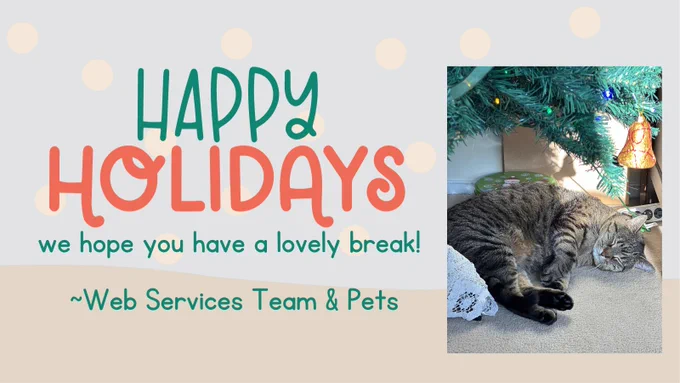 Happy holidays from Web Services and their pets. Cat under a tree