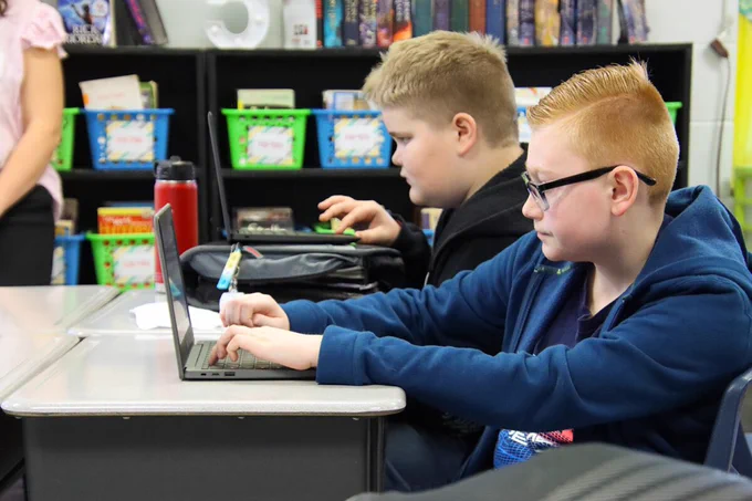 Kids working on a computer