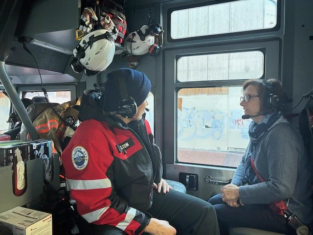 Congresswoman Bonamici speaks with a member of PF&R's Station 1 during a ride-along.