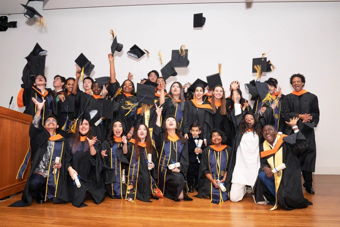 The MDevEng class of 2023 celebrates after receiving their diplomas. (Photo by Amy Sullivan)