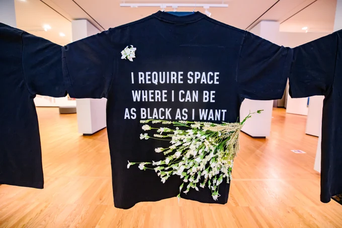 black shirts with flowers attached