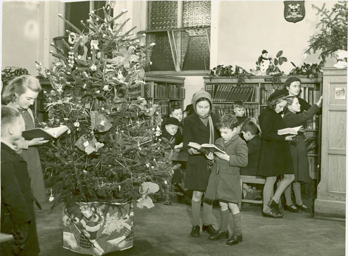 Black and white image of library with christmas tree