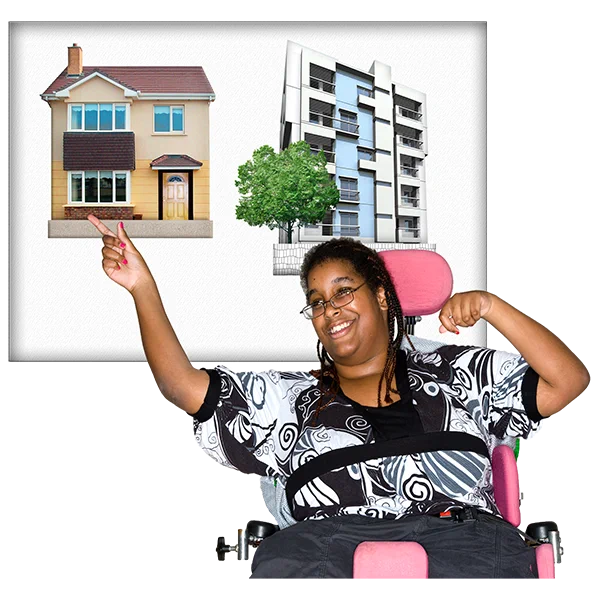A person in a wheelchair pointing at an image of a house. There is also an image of a block of flats to their right. 