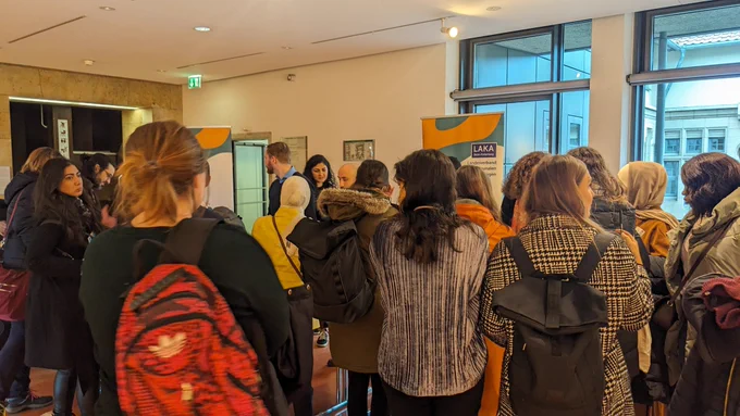 People queuing to register for the conference 