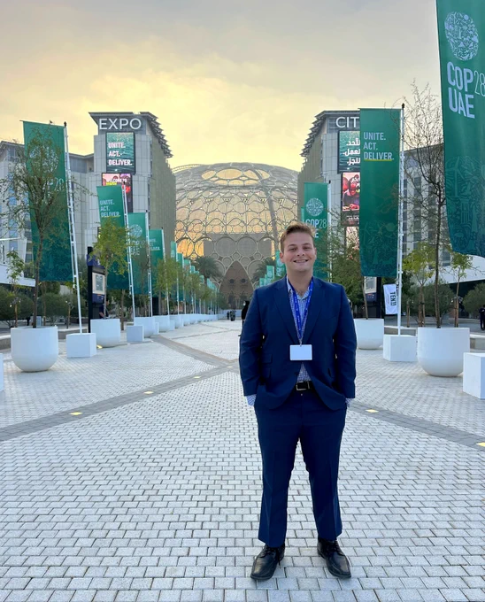 Jacob at the main entrance to COP