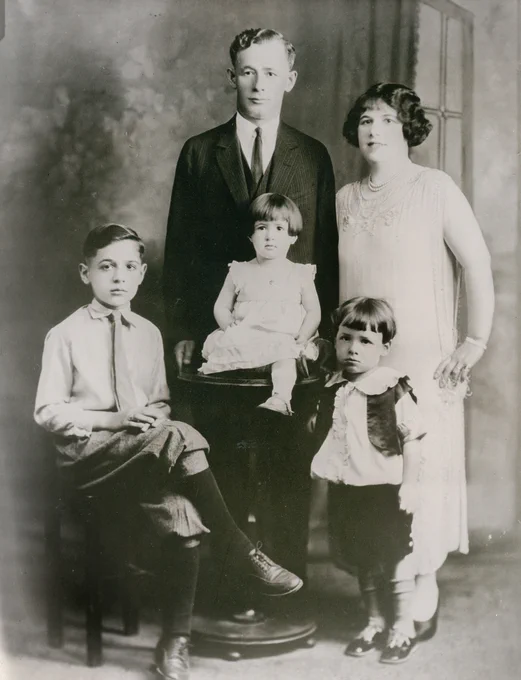 Black and white image of the Goldfarb family: father, Louis, and mother, Rose, standing behind eldest son Bernard sitting at left, Bernice sitting center, and Eddy standing on the right. (Courtesy of the Goldfarb family)