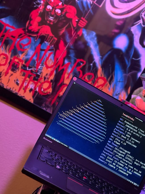 neofetch on EndeavourOS showing Linux Kernel 6.6.6-arch1-1 on a Lenovo T450s in front of an Iron Maiden, The Number of the Beast poster.