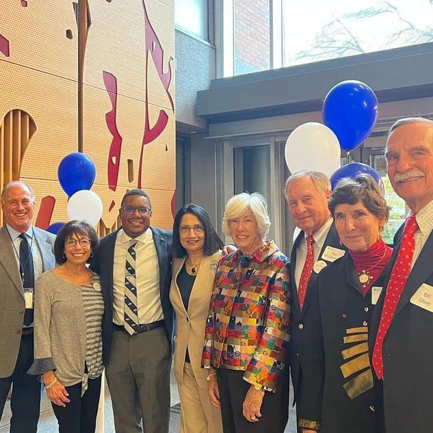 Penn State College of the Liberal Arts longtime benefactors and University leaders pause for a photo at the McCourtney Showcase, held October 27 in the McCourtney Atrium inside Moore Building. From left: Larry and Lynne Brown, alumni and philanthropists; Clarence Lang, Susan Welch Dean of the College of the Liberal Arts; Neeli Bendapudi, Penn State President; Tracy and Ted McCourtney, guests of honor; and Donna and Bill Oliver, alumni and donors. 