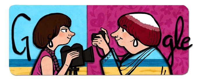 Illustration of two Agnes Varda's of different ages looking towards each other. She's a young version of herself on the left in a beach setting and an older version of herself on the right with a purple background. She holds cameras in both. The Google letters surround the scene with the women's heads replacing both Os.