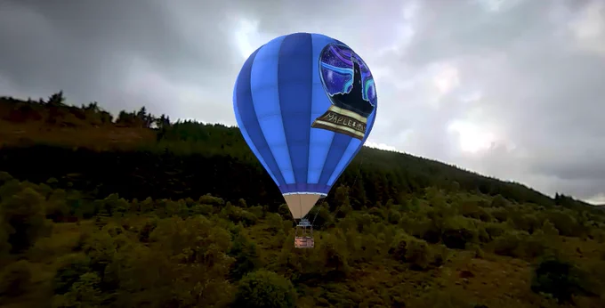 Digital rendering of the virtual reality experience of Plynlimon: a landscape shot and a blue hot air balloon which has taken off. 