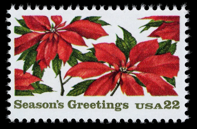 U.S. 22 cent postage stamp featuring illustrated poinsettia plants.
