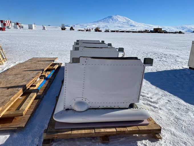Fairings for mounting radar antenna await testing in front of Mount Erebus, Antarctica. 