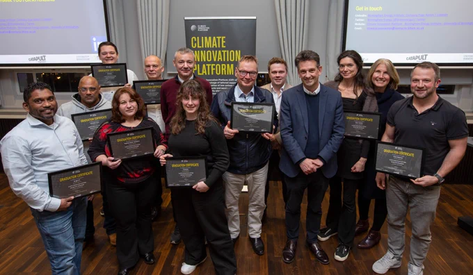 The graduates gather with their certificates 