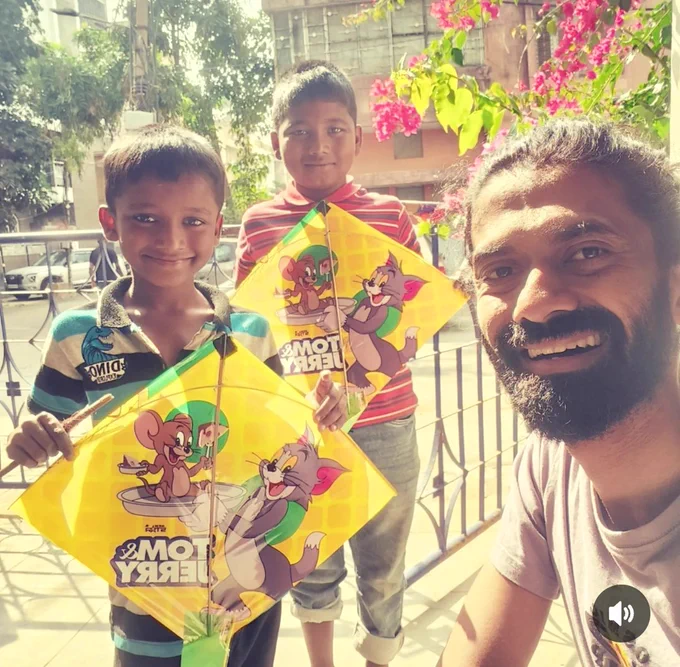 2 boys flying kites that were repaired by me, Manish Pole