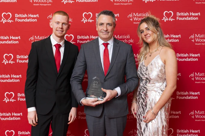 Elijah Behr holding his BHF award