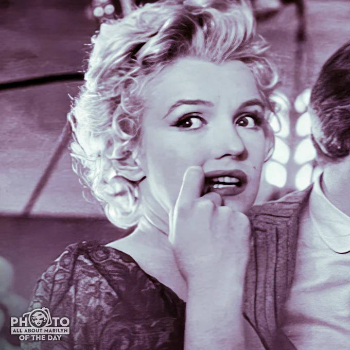 Marilyn Monroe on the set of Bus Stop nibbling her finger.