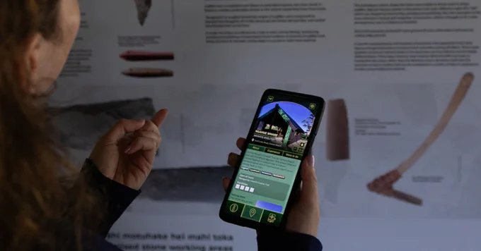 Mobile phone with the Pounamu Pathway app running, open on the Ngahue Whare page.