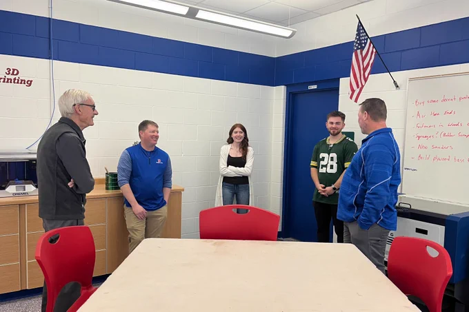 Gov. Evers talks with students and educators.