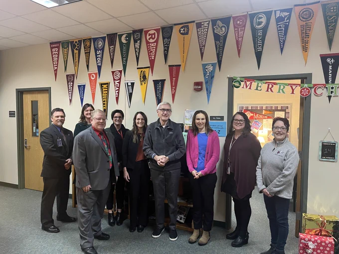 Gov. Evers with school administrators and faculty.
