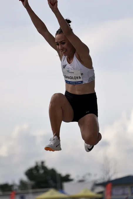 Diana mid-triple jump, while competing at the 2023 Pacific Games in the Soloman Islands